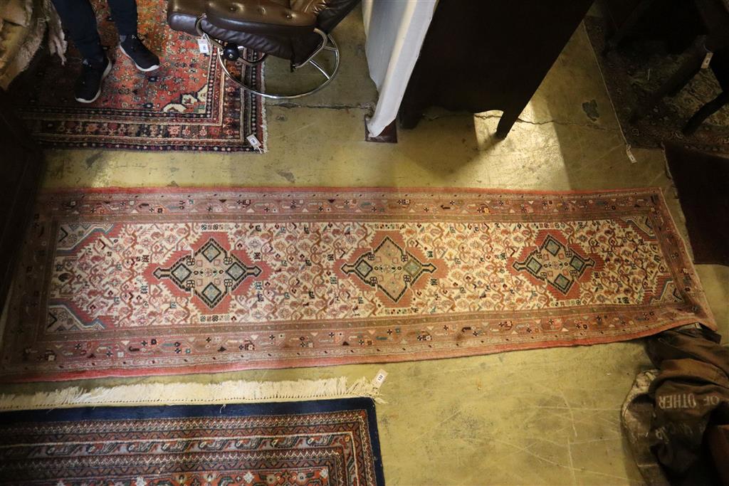 A North West Persian red ground rug, 280 x 140cm, together with a runner